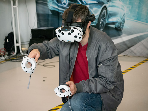 Man wearing VR headset with controllers