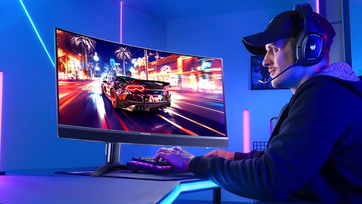 Gamer using curved Predator gaming monitor