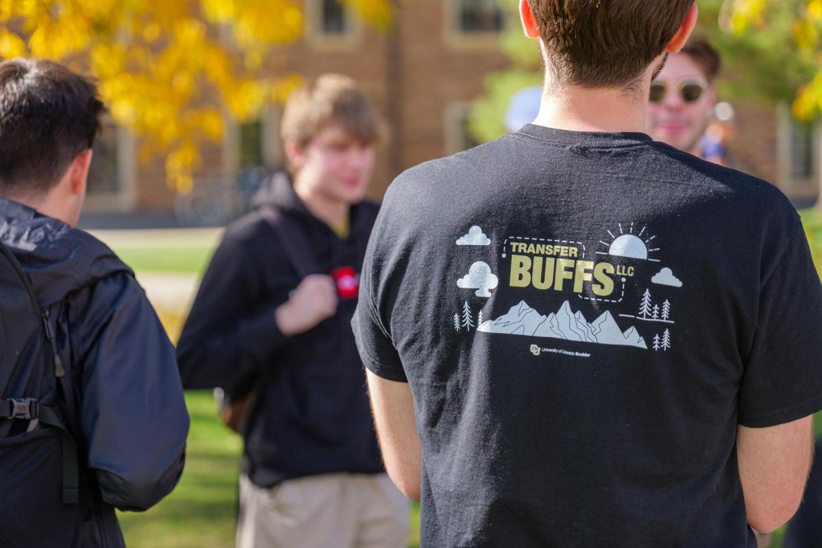 Man wearing Transfer Buffs t-shirt outdoors